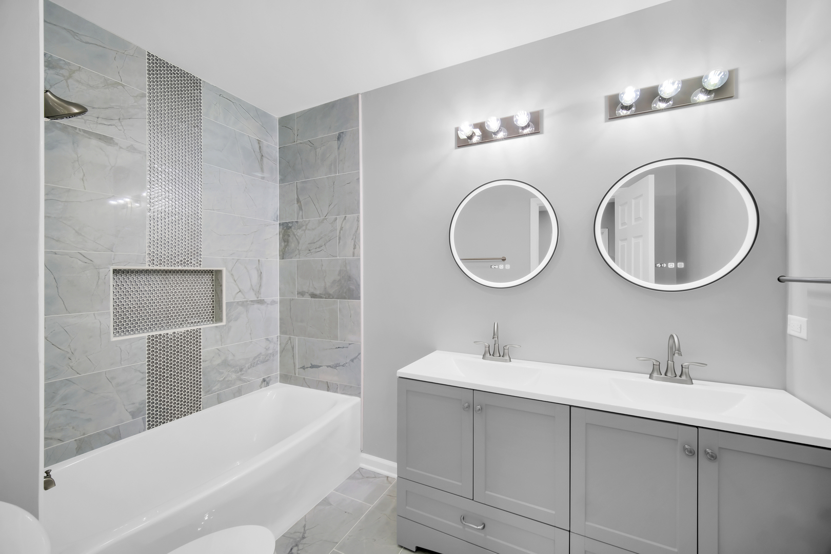 28W360 Roosevelt Road Winfield, IL 60190 - Photo 28 of 50 a bathroom with a double vanity sink and a mirror