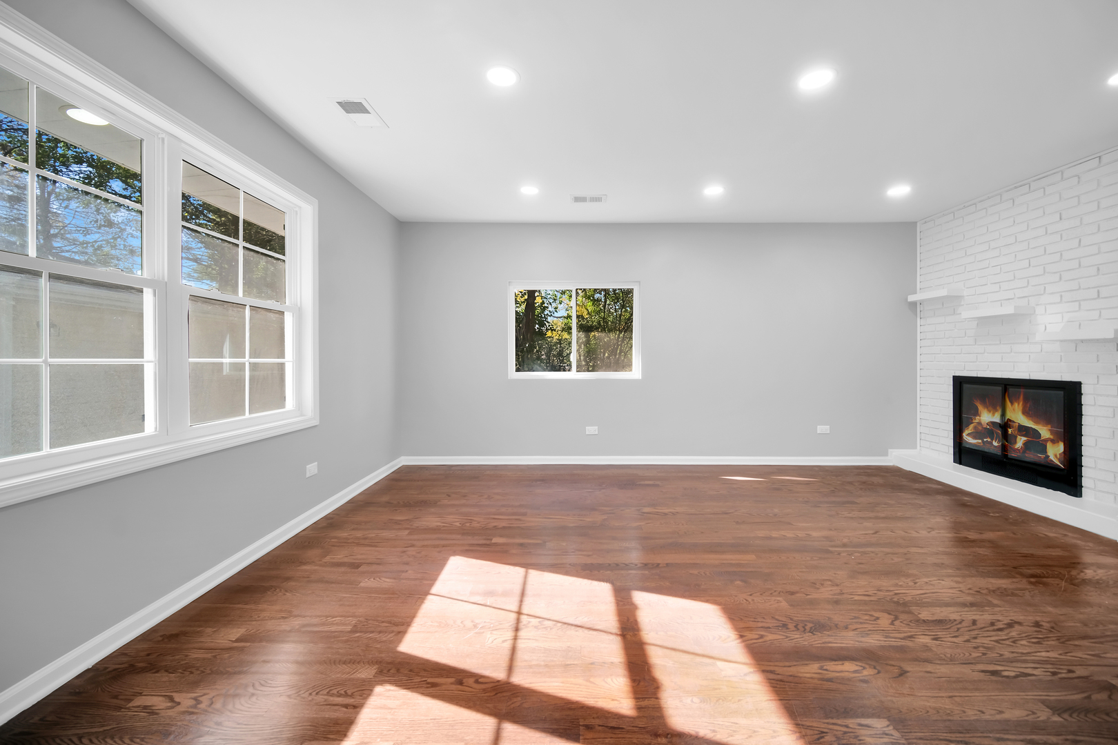 28W360 Roosevelt Road Winfield, IL 60190 - Photo 35 of 50 a view of an empty room with a window and fireplace