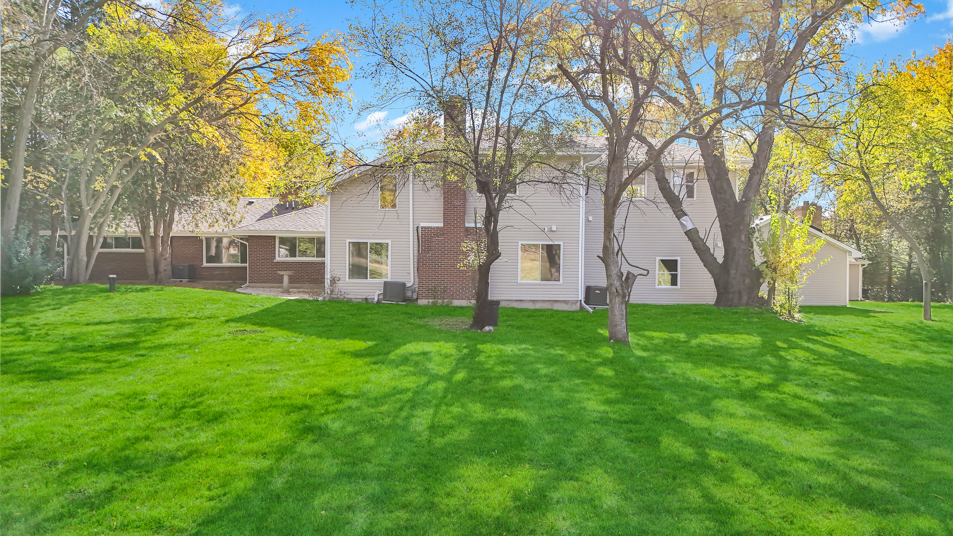 28W360 Roosevelt Road Winfield, IL 60190 - Photo 46 of 50 a view of a house with a yard
