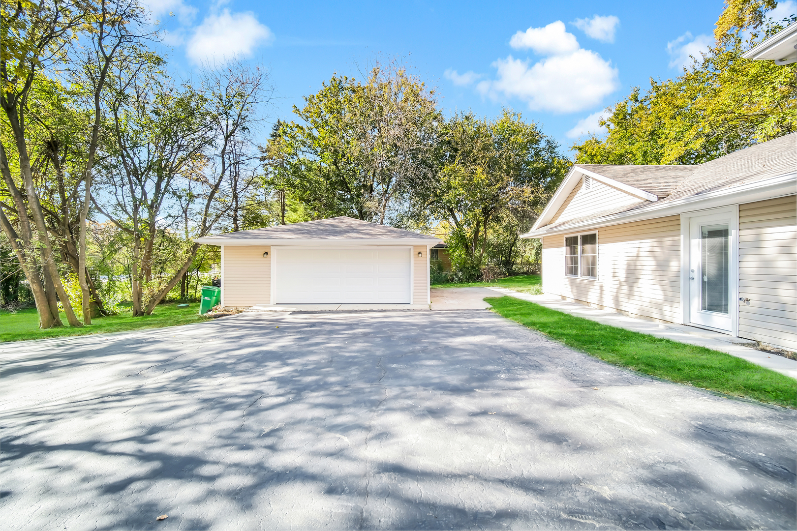 28W360 Roosevelt Road Winfield, IL 60190 - Photo 6 of 50 a view of a house with a yard and garage