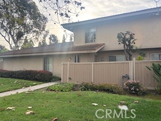14122 Raintree Road Tustin, CA 92780 - Photo 1 of 1 a front view of a house with garden