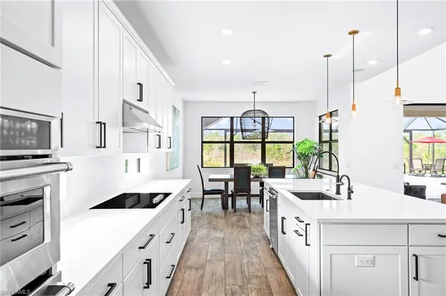 a utility room with a sink dryer and washer