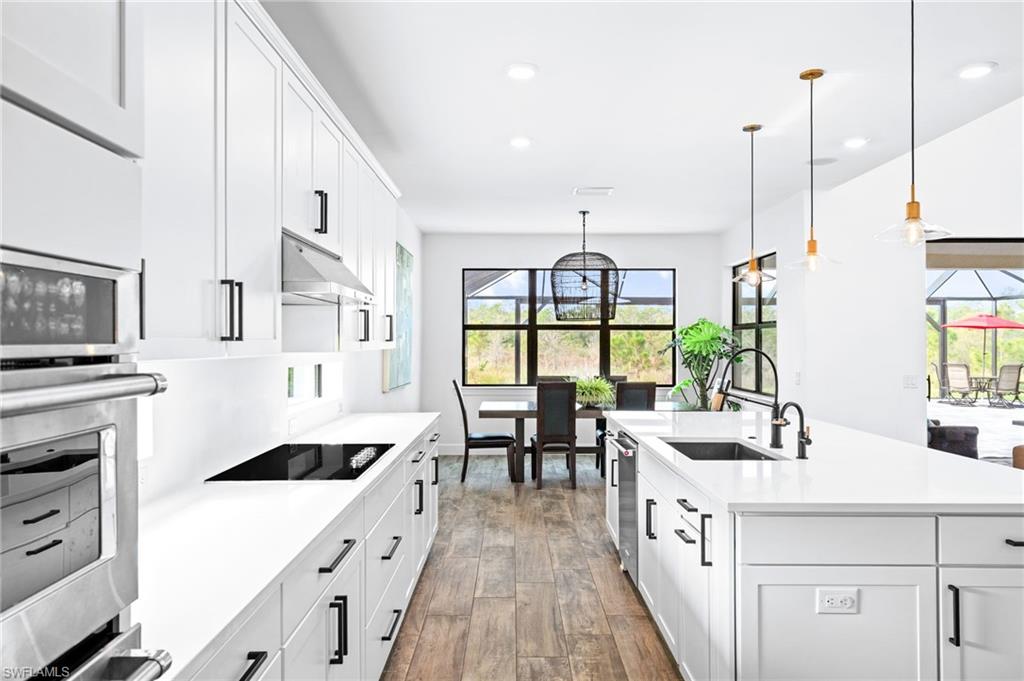 19836 Beverly Park Road Estero, FL 33928 - Photo 13 of 40 a kitchen with counter top space and windows