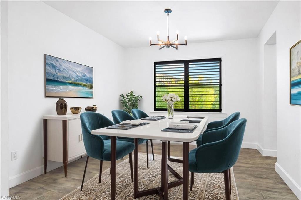 19836 Beverly Park Road Estero, FL 33928 - Photo 15 of 40 a view of a dining room with furniture window and wooden floor