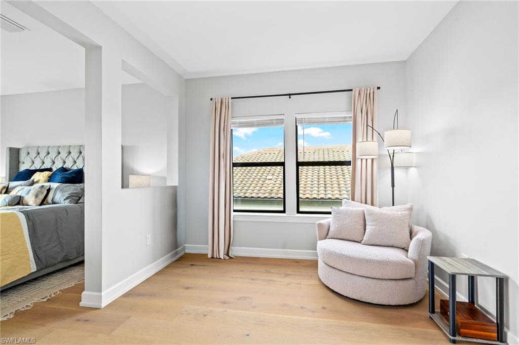 19836 Beverly Park Road Estero, FL 33928 - Photo 18 of 40 a living room with furniture and a window