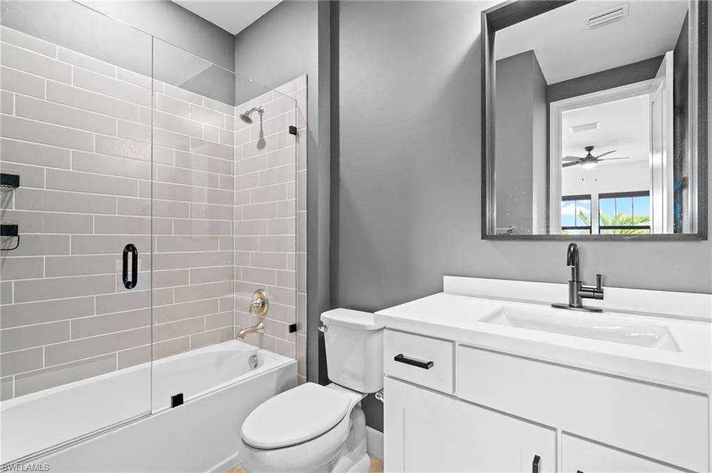19836 Beverly Park Road Estero, FL 33928 - Photo 25 of 40 a bathroom with a sink toilet and shower