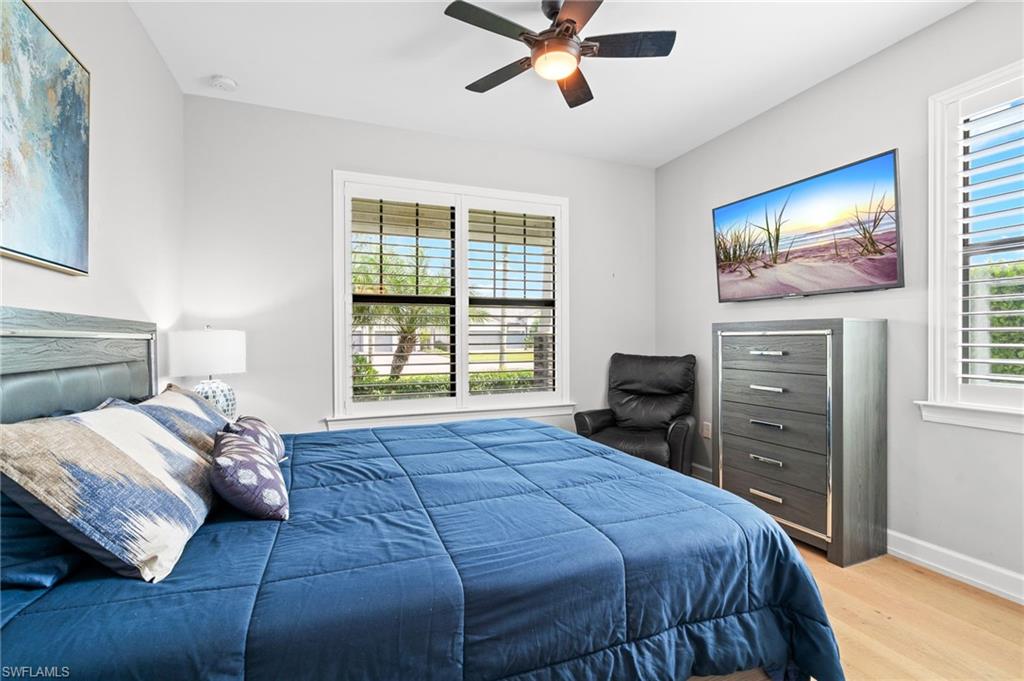 19836 Beverly Park Road Estero, FL 33928 - Photo 28 of 40 a bedroom with a bed and a television
