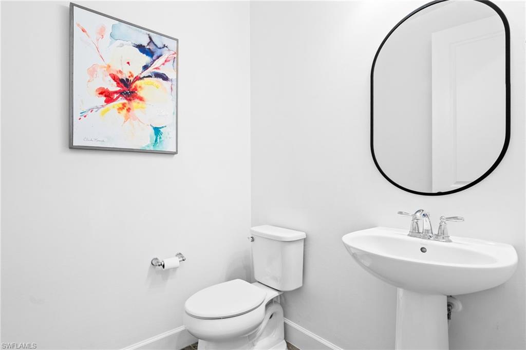 19836 Beverly Park Road Estero, FL 33928 - Photo 29 of 40 a bathroom with a a sink and a mirror