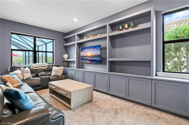 a room with furniture and a flat screen tv