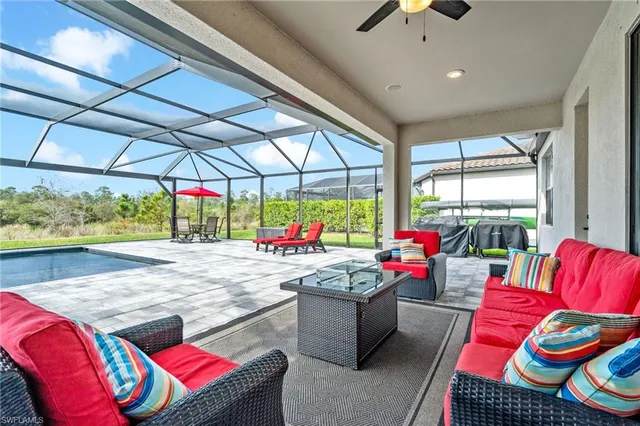 a view of balcony with furniture and garden