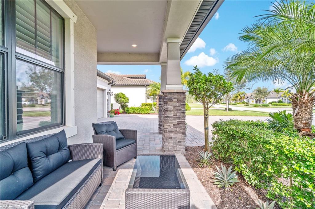 19836 Beverly Park Road Estero, FL 33928 - Photo 37 of 40 a view of balcony with furniture and garden