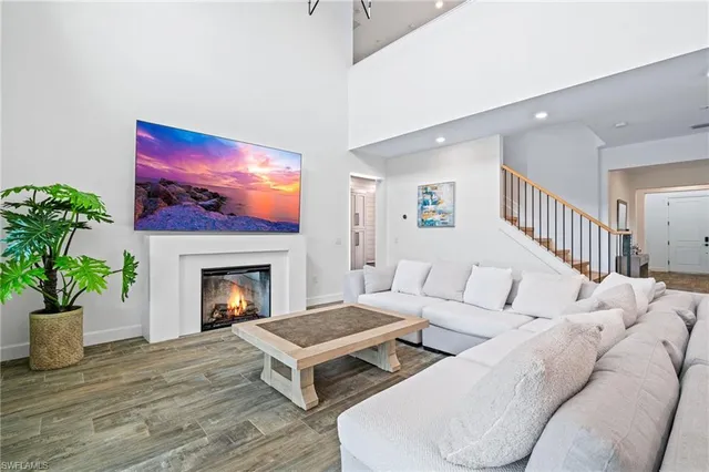a kitchen that has a lot of cabinets and wooden floor