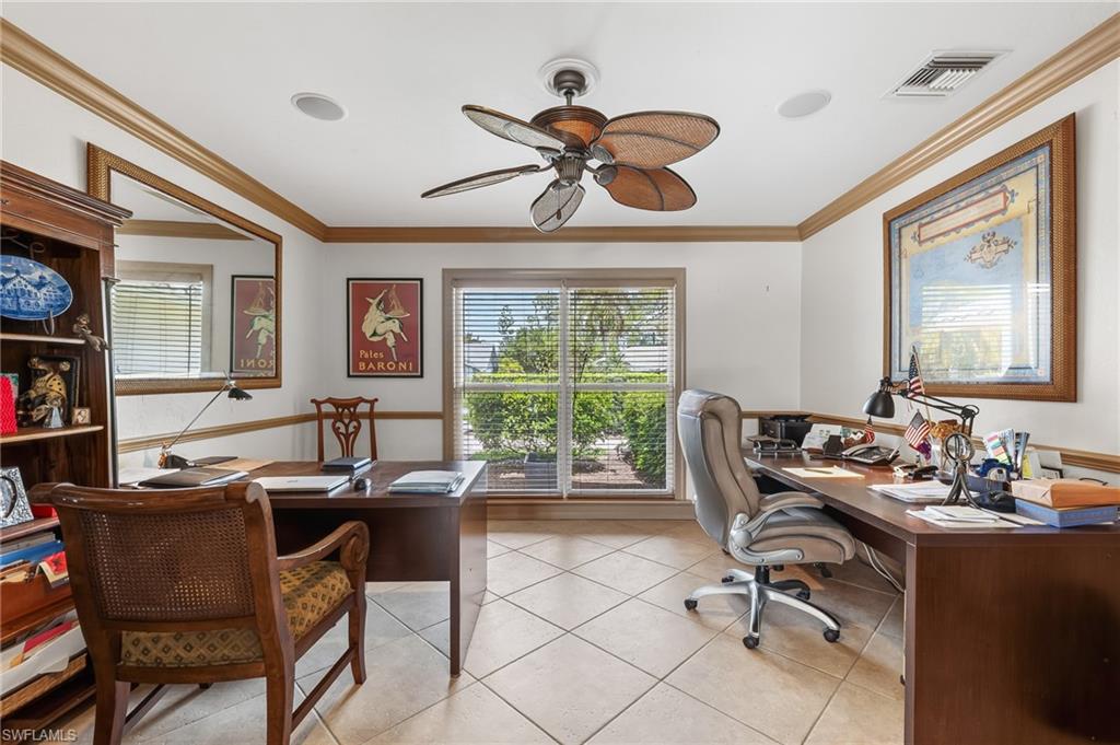 1904 Countess Court Naples, FL 34110 - Photo 24 of 33 a dining room with wooden floor and a window