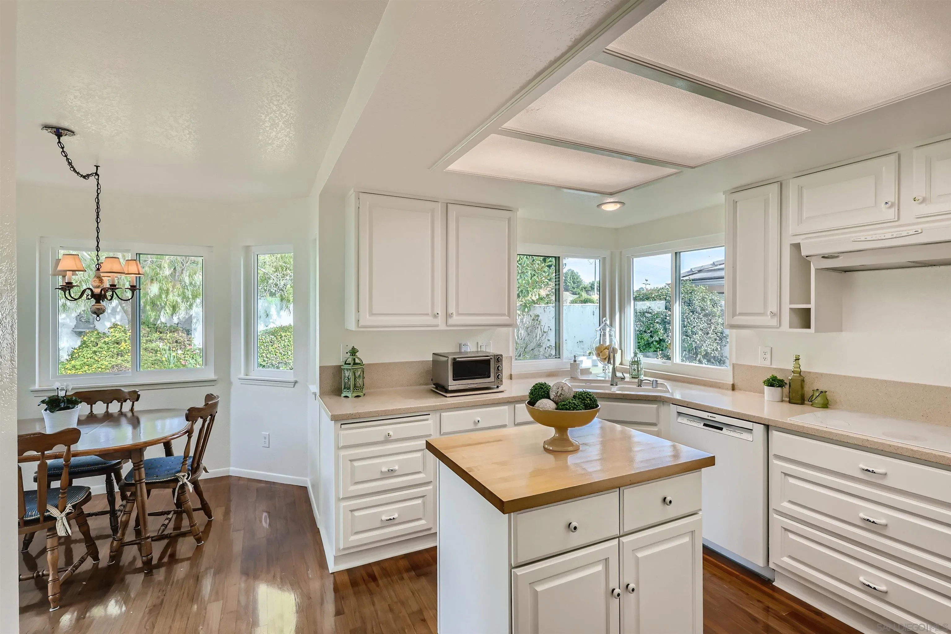 15015 Caminito Ladera Del Mar, CA 92014 - Photo 11 of 25 a kitchen with a sink stove and cabinets