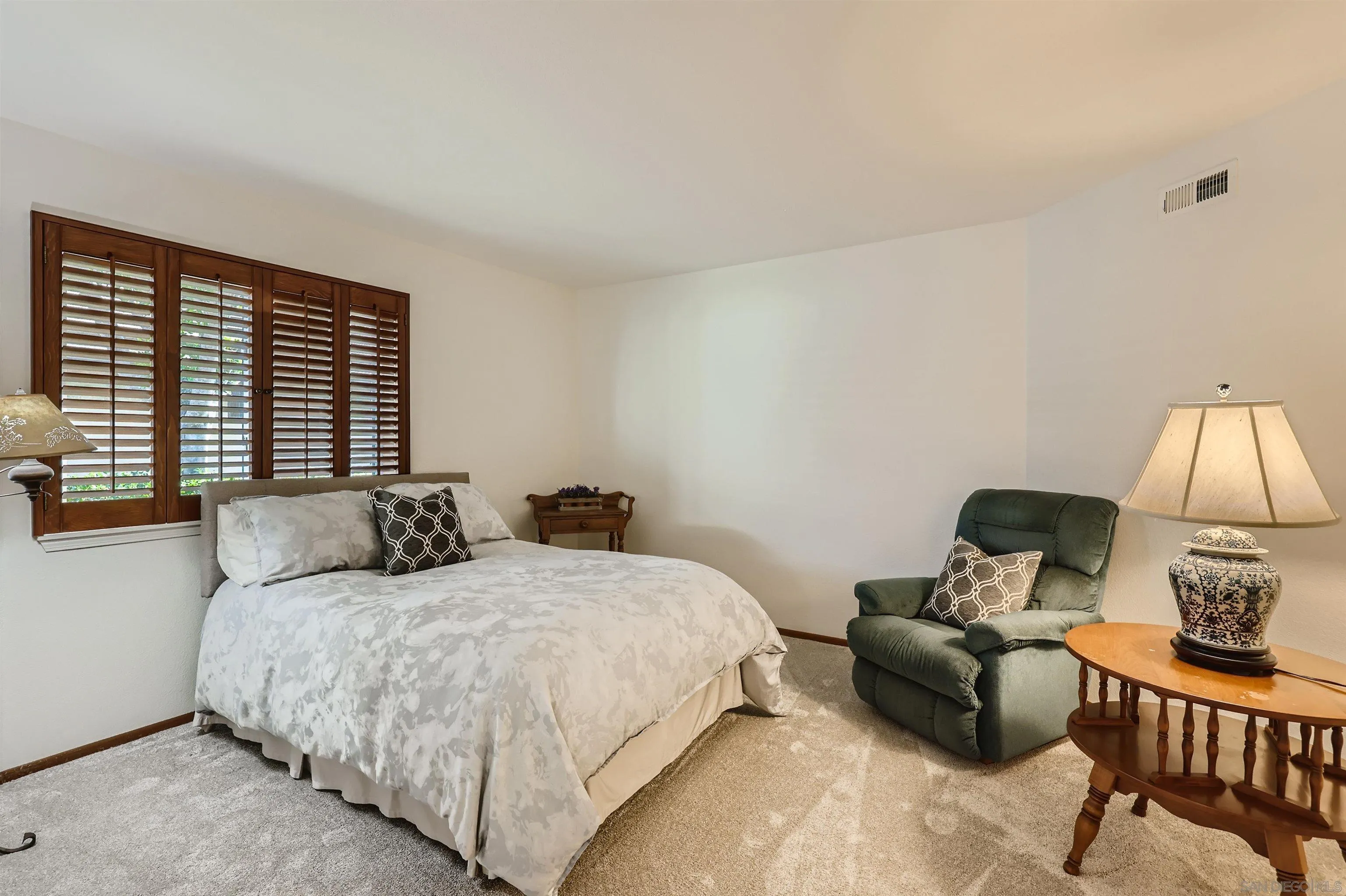 15015 Caminito Ladera Del Mar, CA 92014 - Photo 14 of 25 a bedroom with two beds and a couch