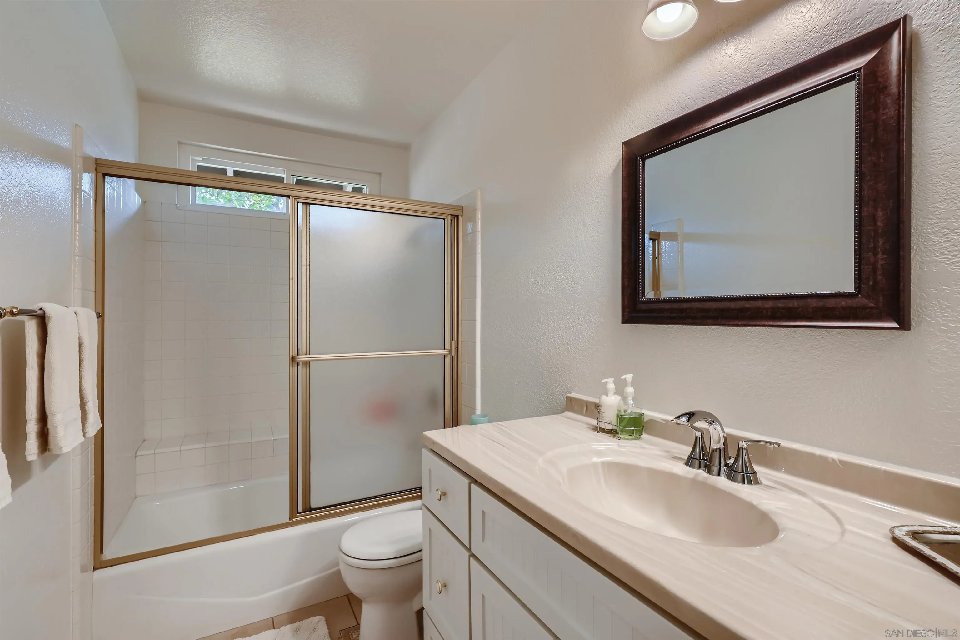 15015 Caminito Ladera Del Mar, CA 92014 - Photo 15 of 25 a bathroom with a sink toilet and shower