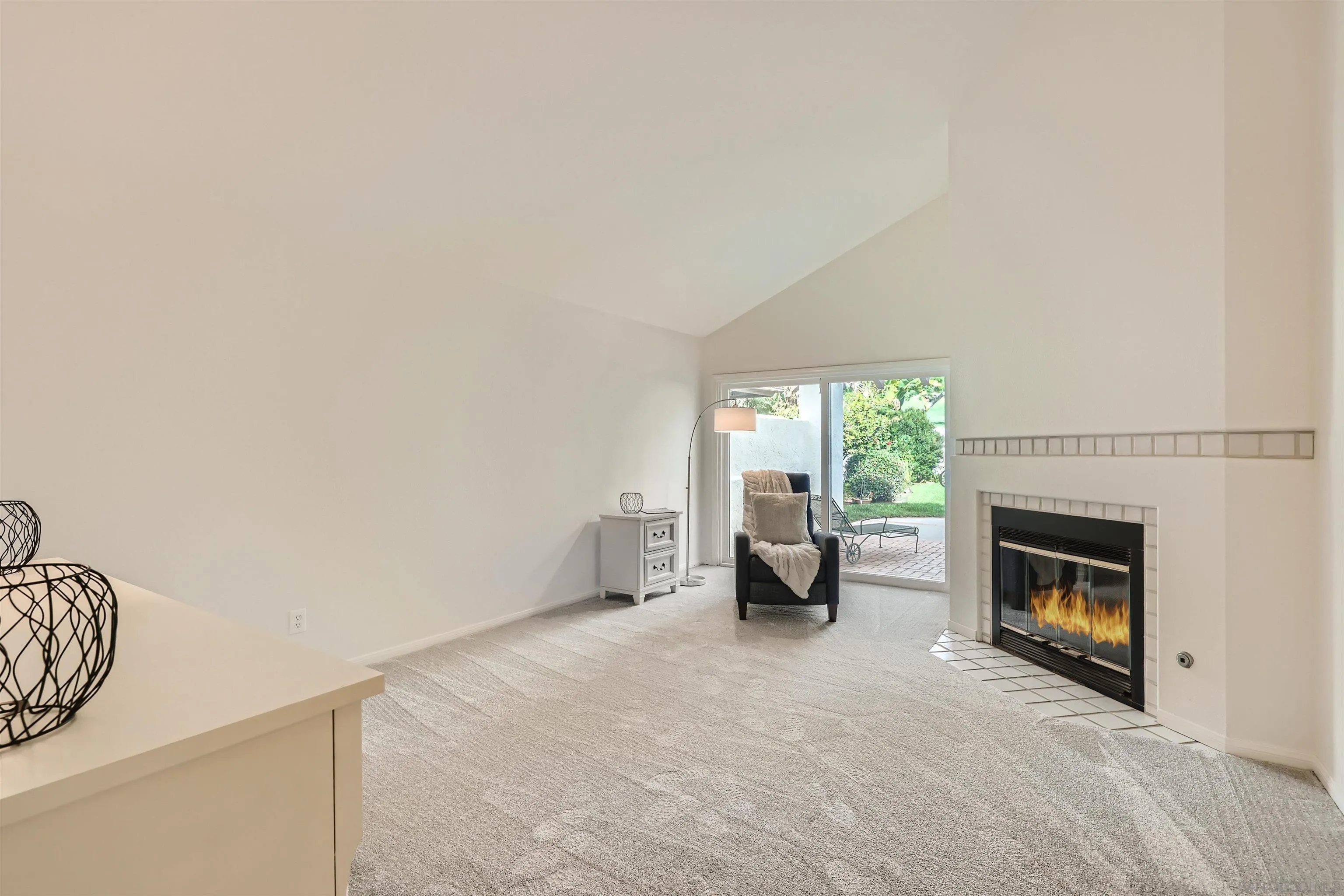 15015 Caminito Ladera Del Mar, CA 92014 - Photo 17 of 25 a view of empty room with furniture and a fireplace