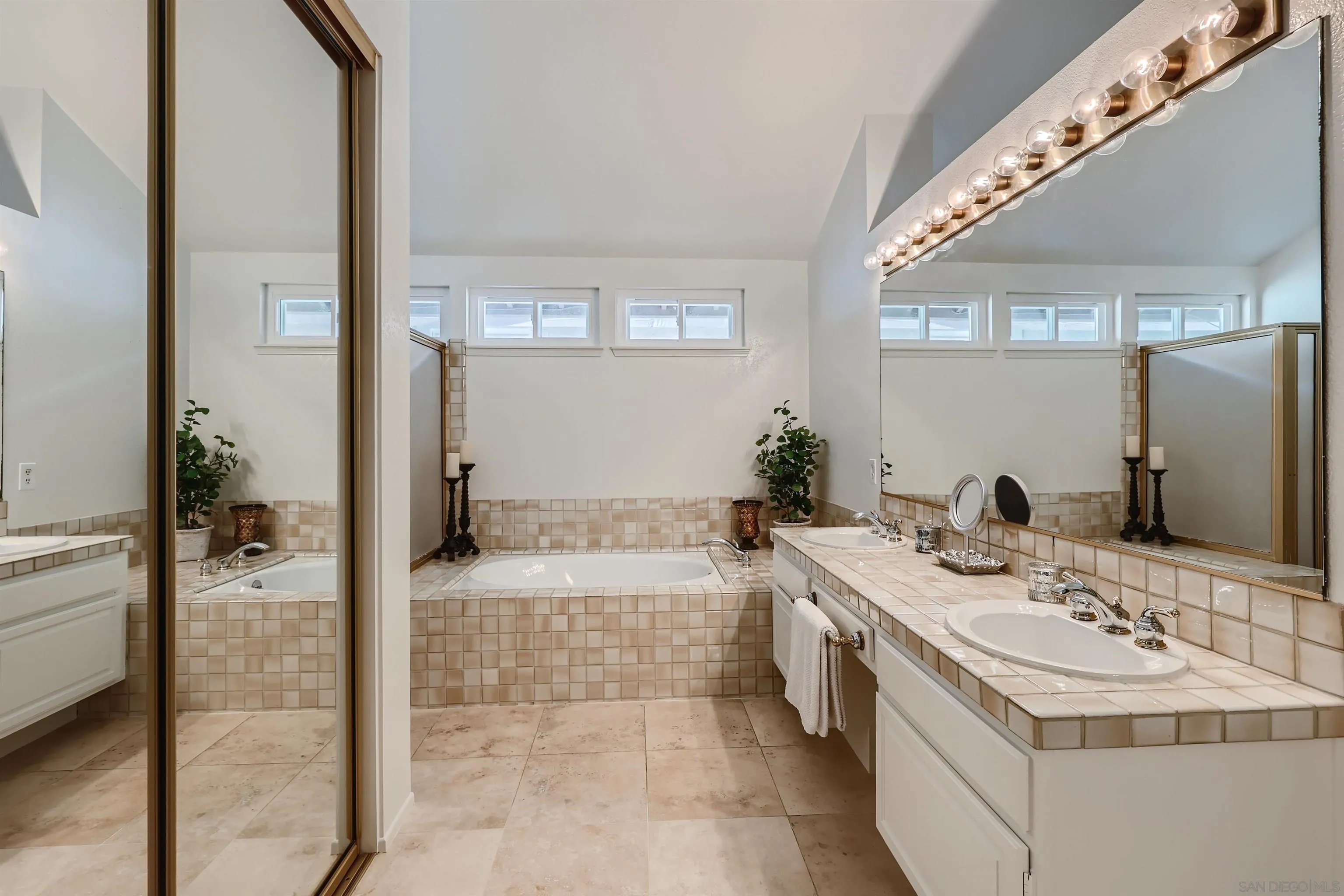 15015 Caminito Ladera Del Mar, CA 92014 - Photo 18 of 25 a spacious bathroom with a bathtub sink and mirror
