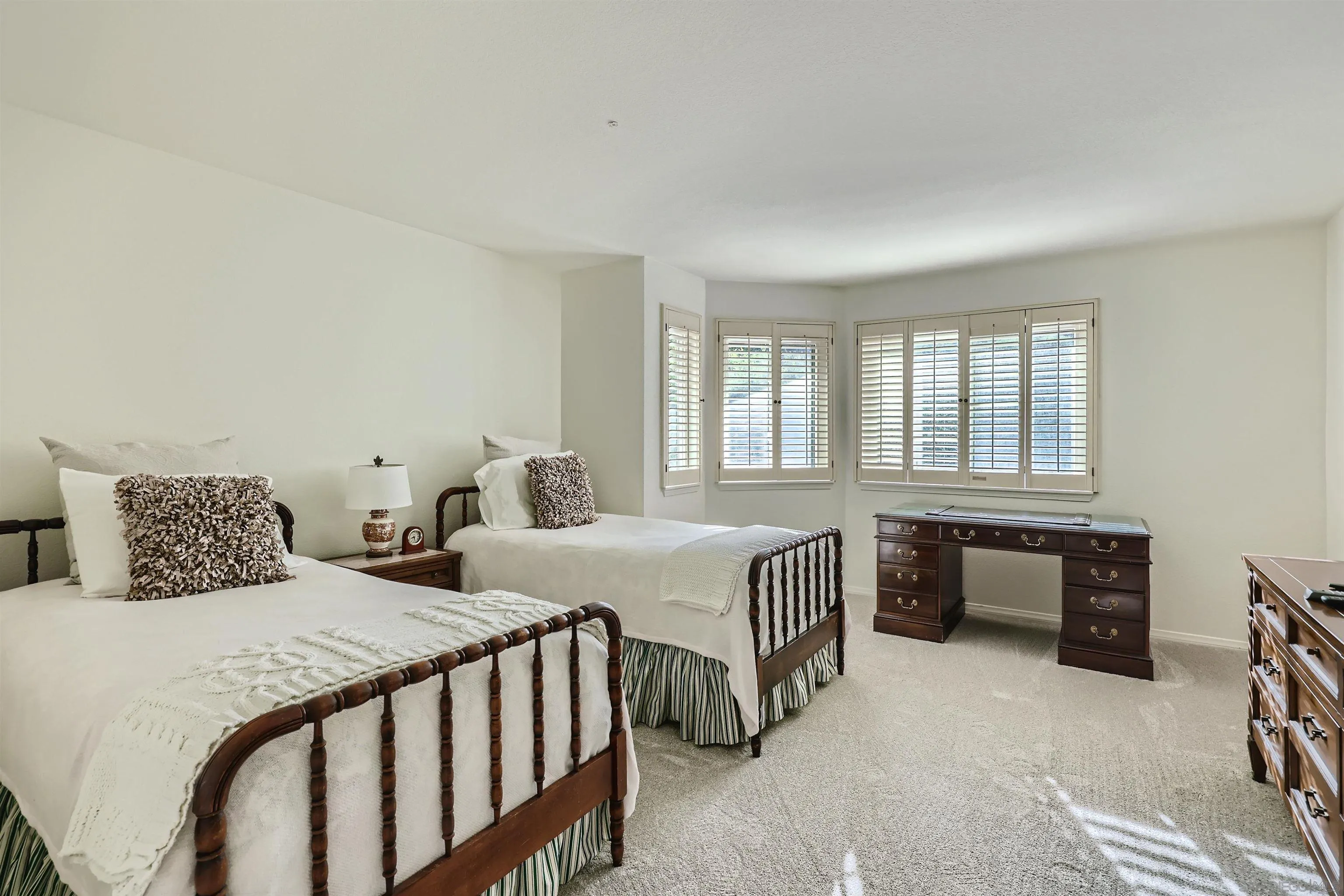 15015 Caminito Ladera Del Mar, CA 92014 - Photo 19 of 25 a bedroom with two beds and a window