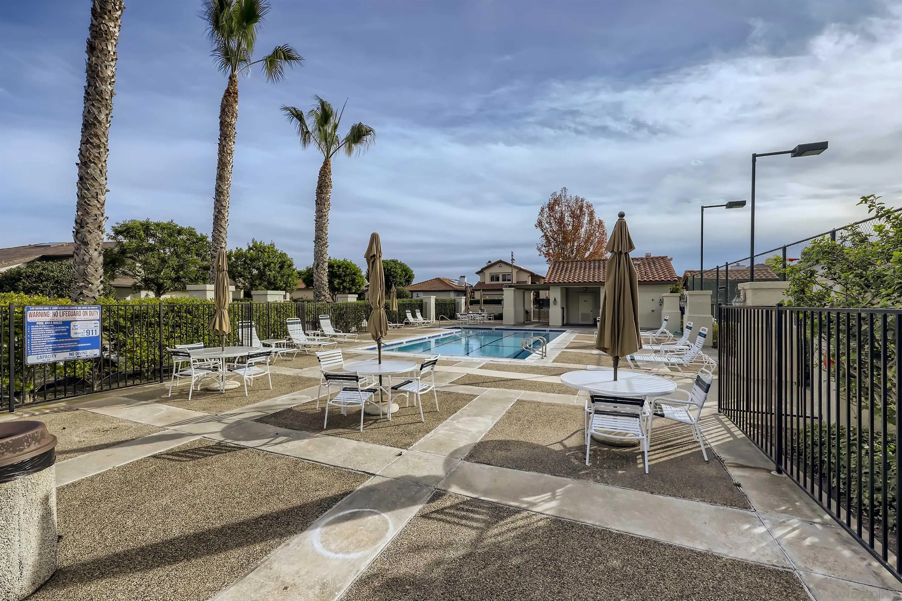 15015 Caminito Ladera Del Mar, CA 92014 - Photo 24 of 25 a view of a patio with a table and chairs and potted plants