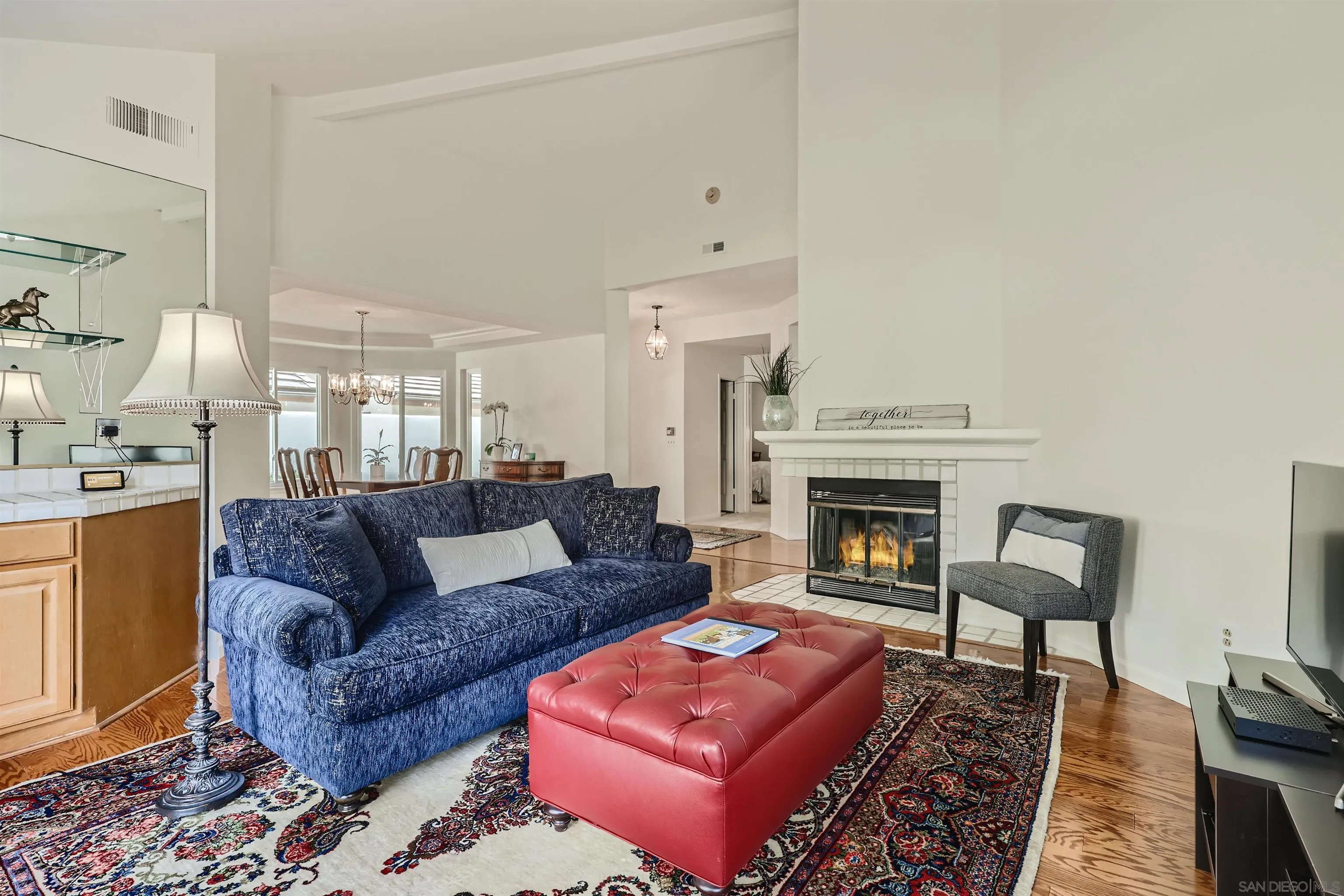15015 Caminito Ladera Del Mar, CA 92014 - Photo 5 of 25 a living room with furniture and a fireplace