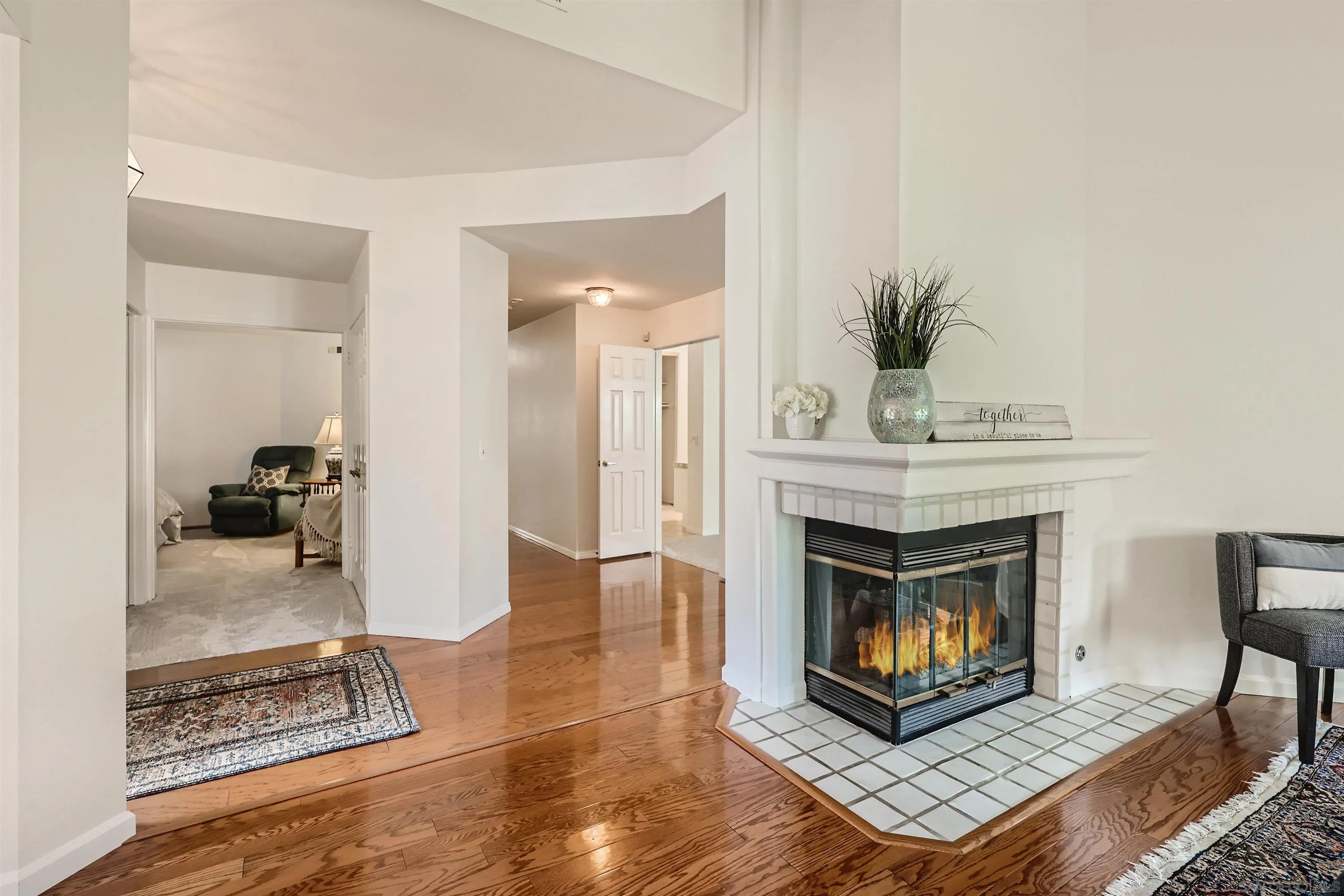 15015 Caminito Ladera Del Mar, CA 92014 - Photo 6 of 25 a living room with furniture and a fireplace