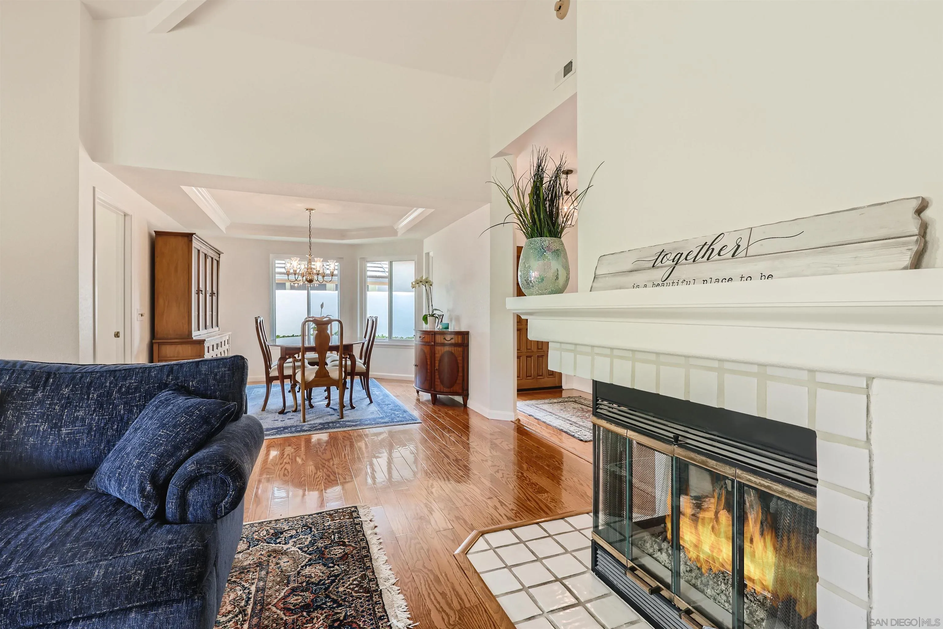 15015 Caminito Ladera Del Mar, CA 92014 - Photo 8 of 25 a living room with furniture a fireplace and a flat screen tv