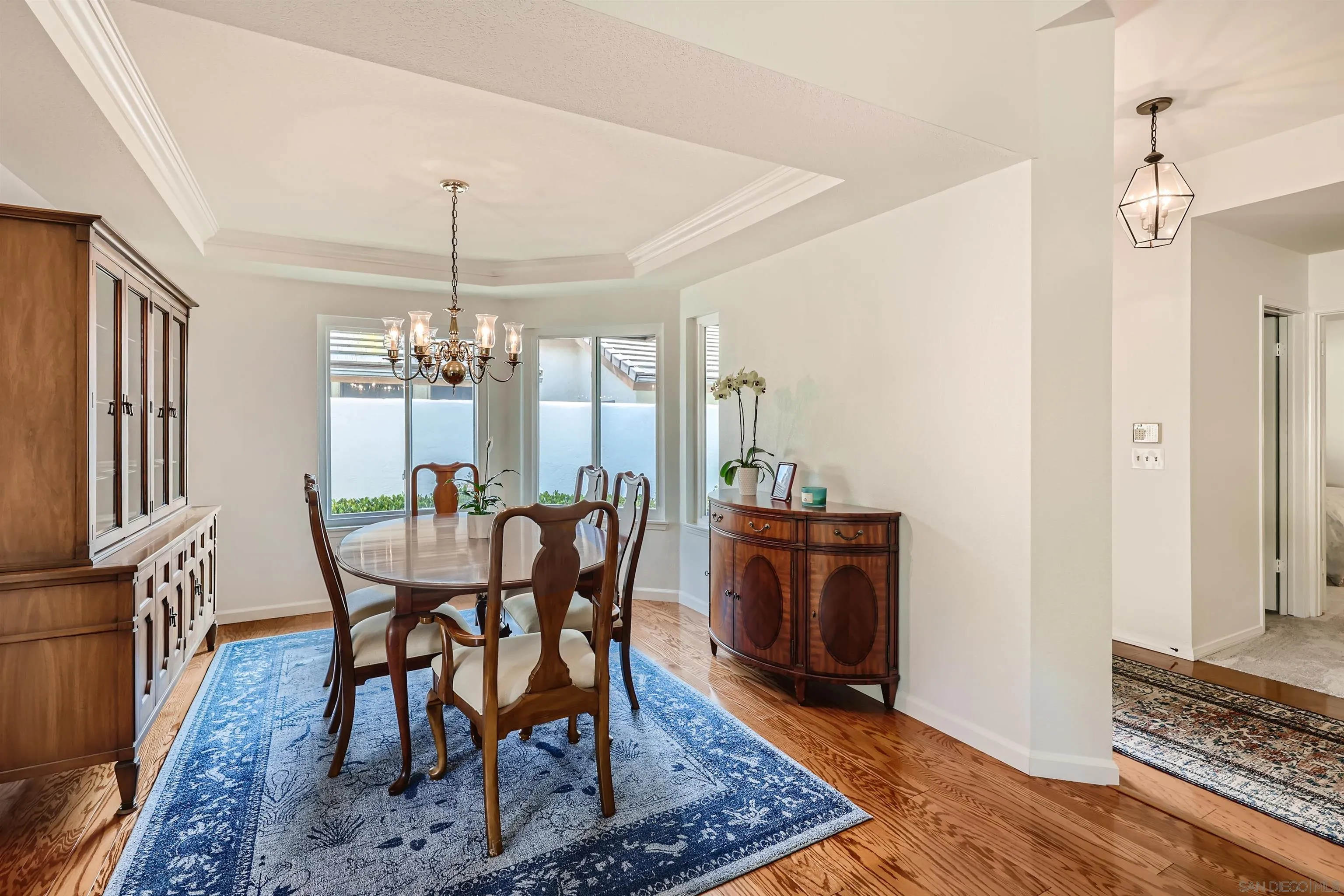 15015 Caminito Ladera Del Mar, CA 92014 - Photo 9 of 25 a view of a dining room with furniture window and wooden floor