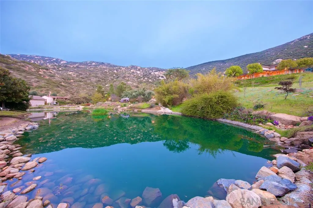14755 Valleyview Road Poway, CA 92064 - Photo 17 of 24 a view of a lake with a mountain in the background