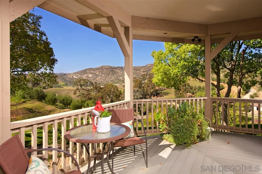 14755 Valleyview Road Poway, CA 92064 - Photo 19 of 24 a view of a balcony with chairs and a table