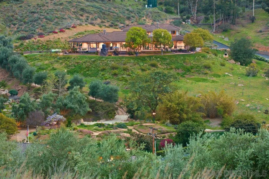 14755 Valleyview Road Poway, CA 92064 - Photo 2 of 24 a view of a bench in middle of the green field