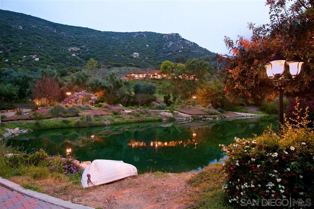 14755 Valleyview Road Poway, CA 92064 - Photo 3 of 24 a view of a lake with a mountain in the background