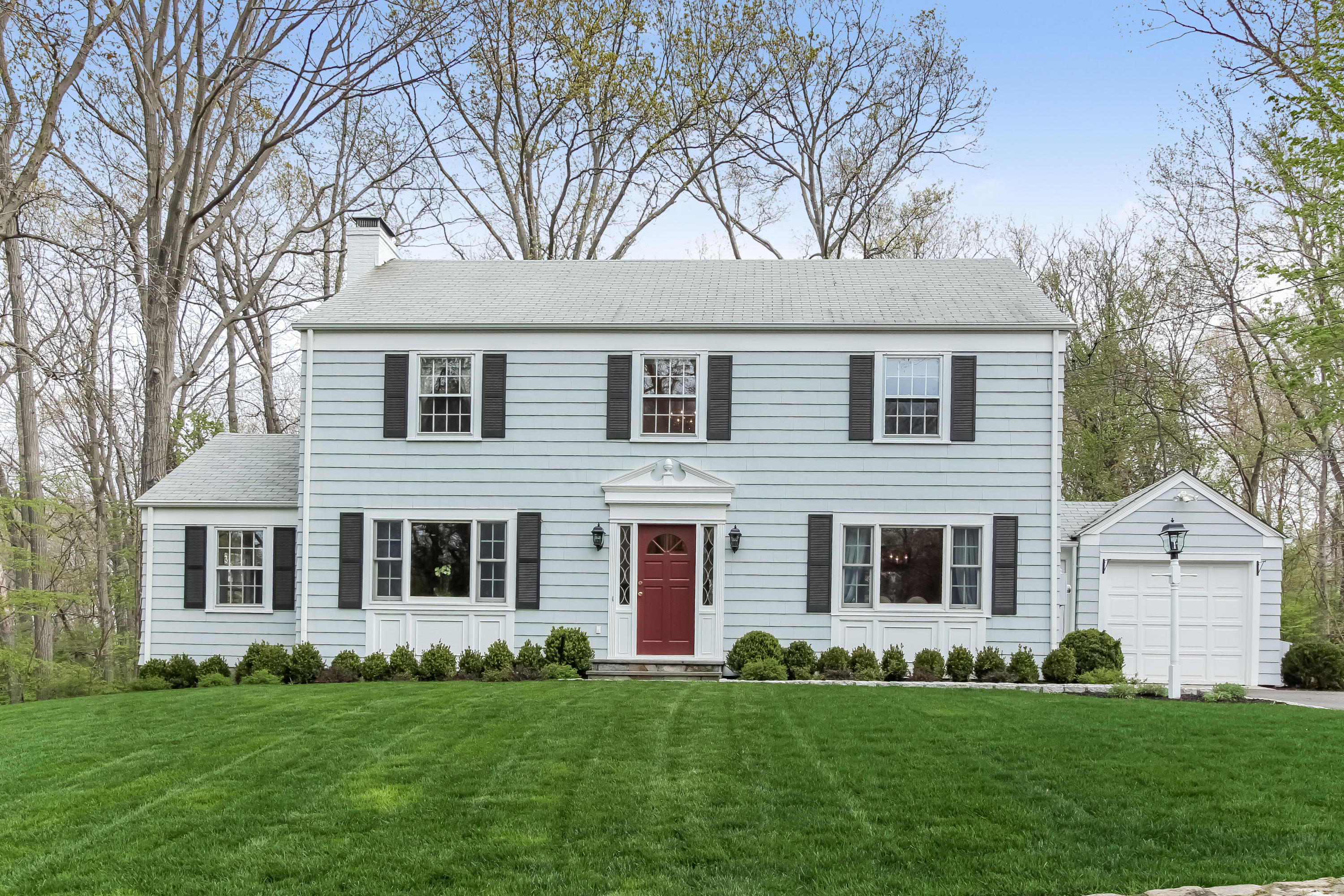 31 Miller Road Darien, CT 06820 - Photo 1 of 29 a front view of a house with a garden