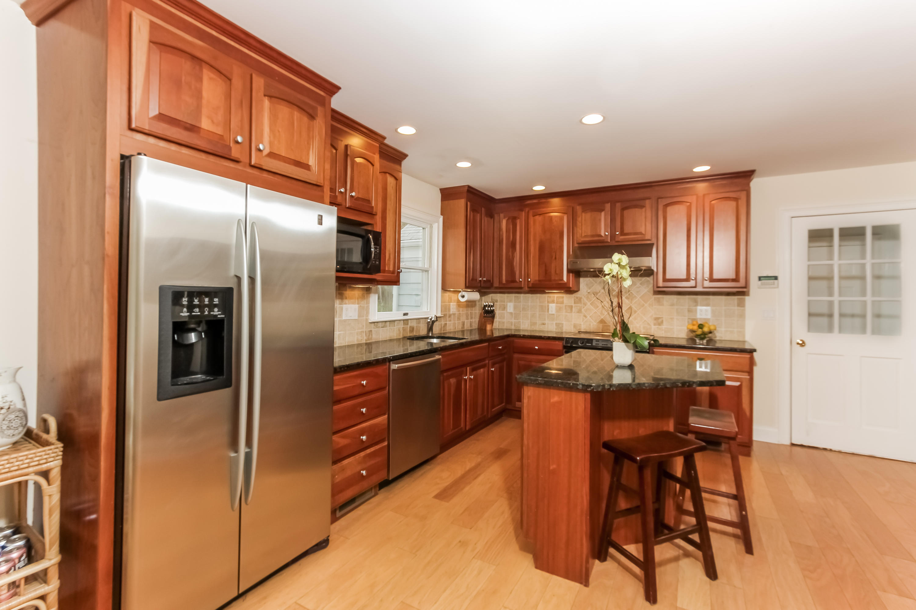 31 Miller Road Darien, CT 06820 - Photo 11 of 29 a kitchen with stainless steel appliances granite countertop a refrigerator and a stove top oven