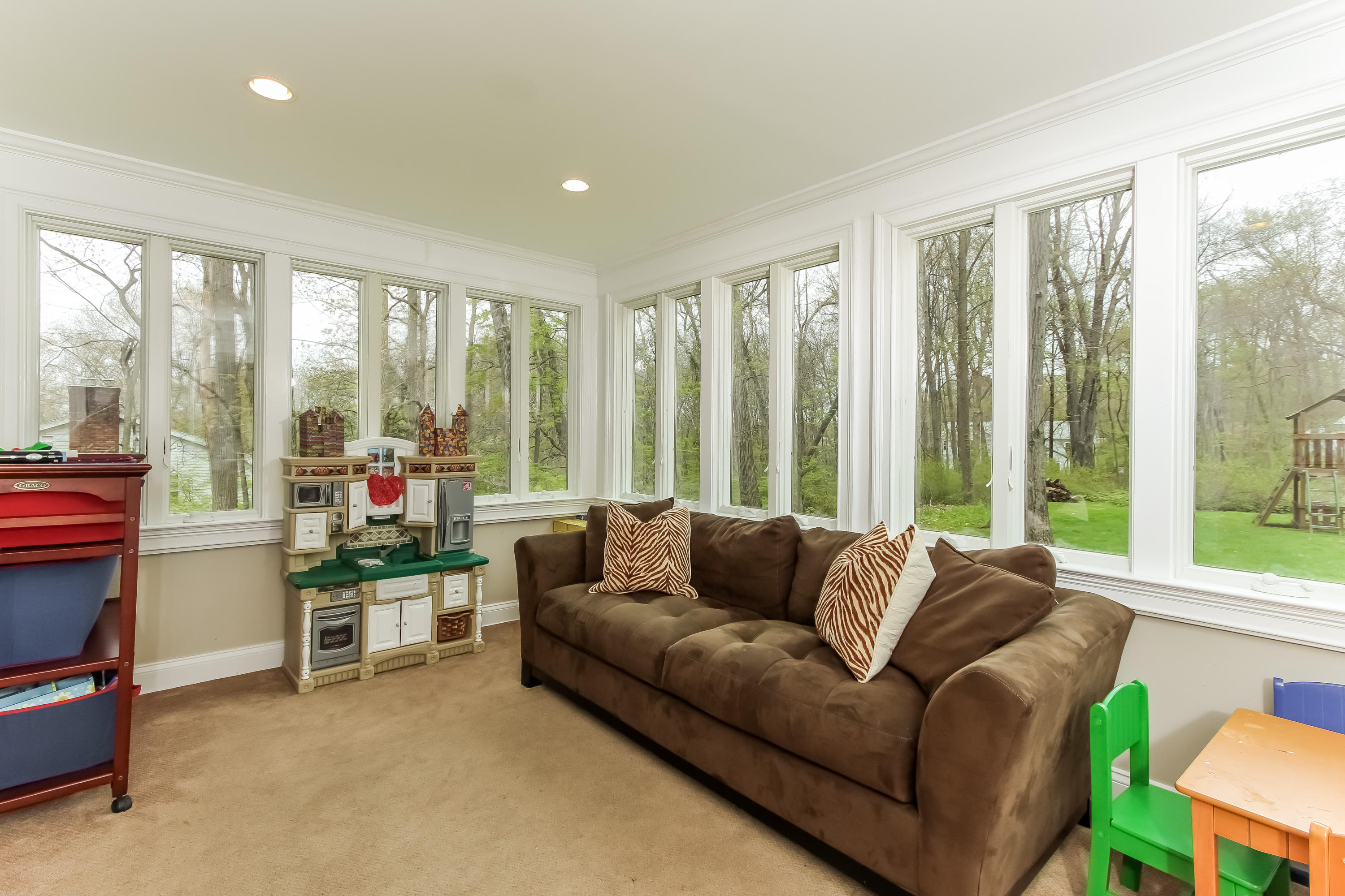 31 Miller Road Darien, CT 06820 - Photo 12 of 29 a living room with furniture and a floor to ceiling window
