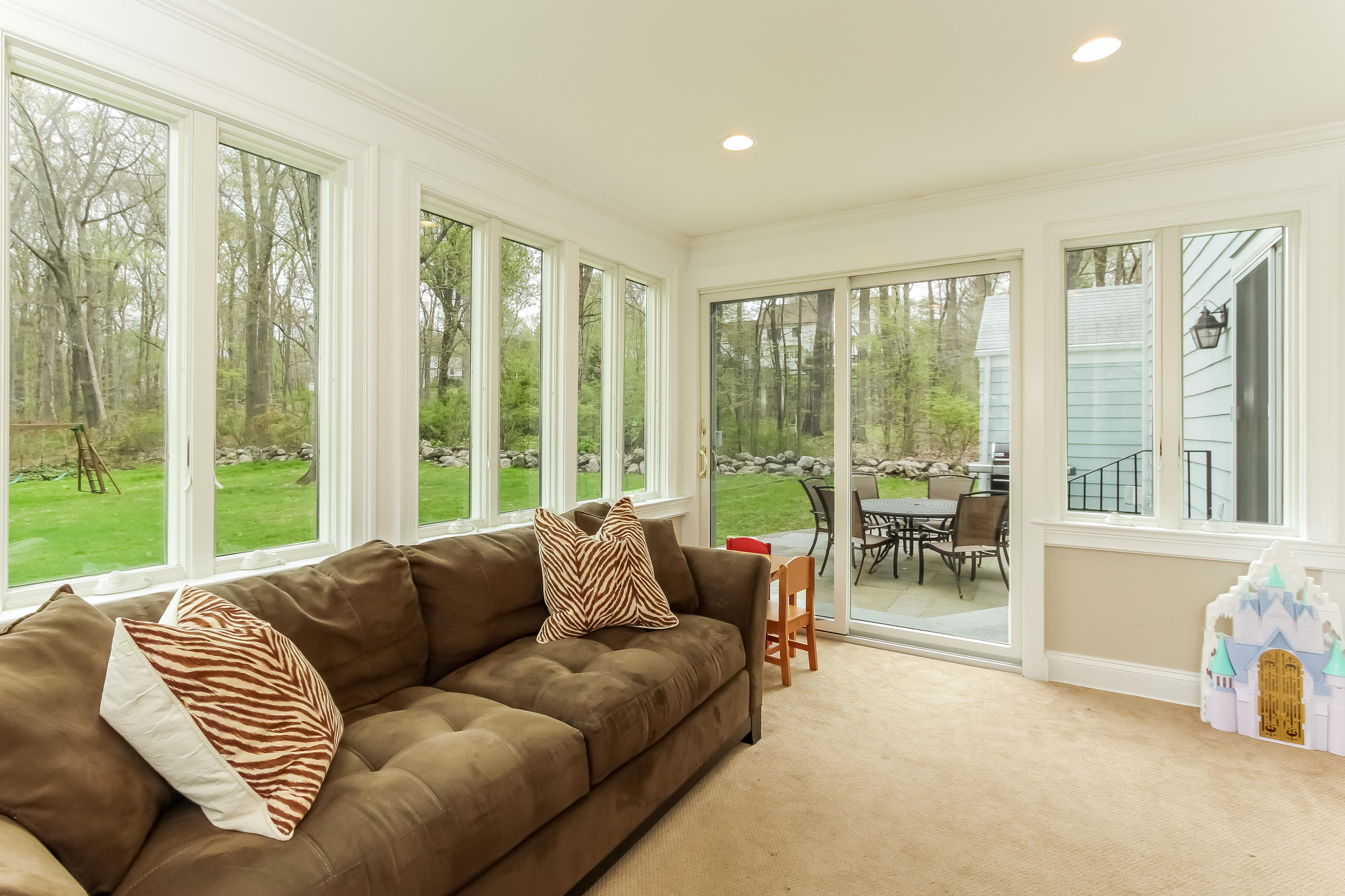 31 Miller Road Darien, CT 06820 - Photo 13 of 29 a living room with furniture and floor to ceiling windows