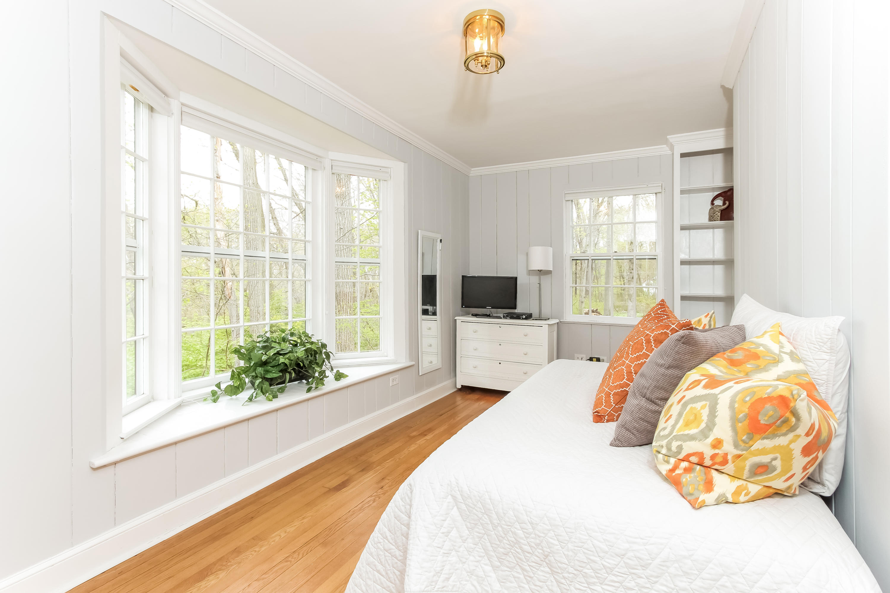 31 Miller Road Darien, CT 06820 - Photo 14 of 29 a bedroom with a bed and a large window