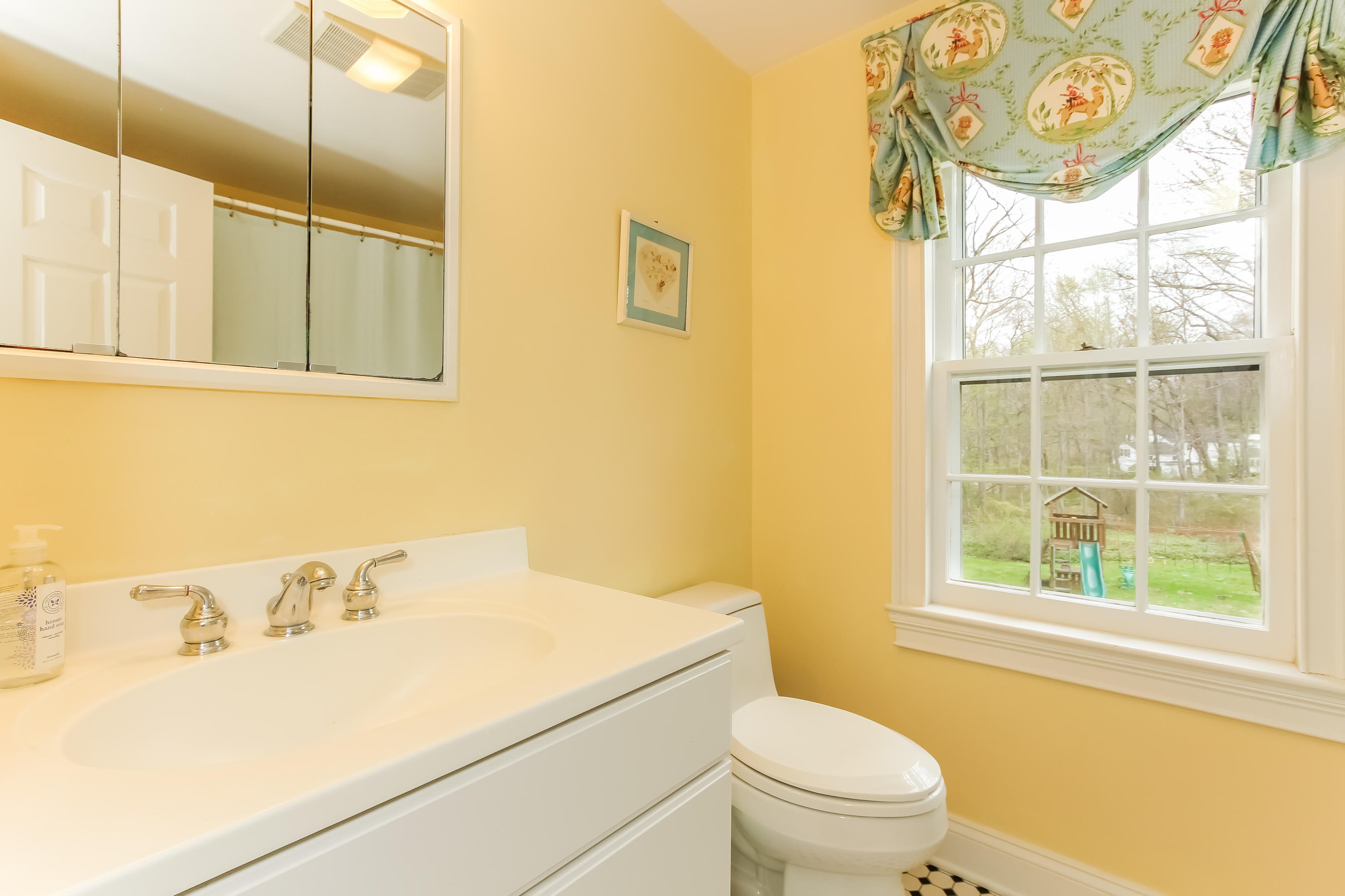 31 Miller Road Darien, CT 06820 - Photo 22 of 29 a bathroom with a sink and a toilet