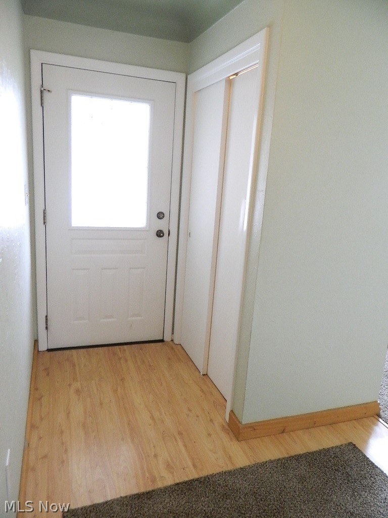 34505 Pettibone Road Solon, OH 44139 - Photo 2 of 32 Foyer Entry with Spacious Guest Closet, Laminate Flooring - Note the Coved Ceilings in the Foyer, Living and Dining Rooms! There is Also a Guest Half Bath Just Off the Foyer!