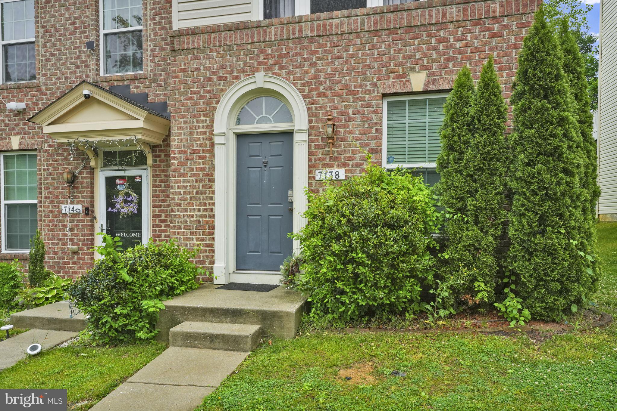 7138 Station House Road Elkridge, MD 21075 - Photo 6 of 42 a front view of a house with garden