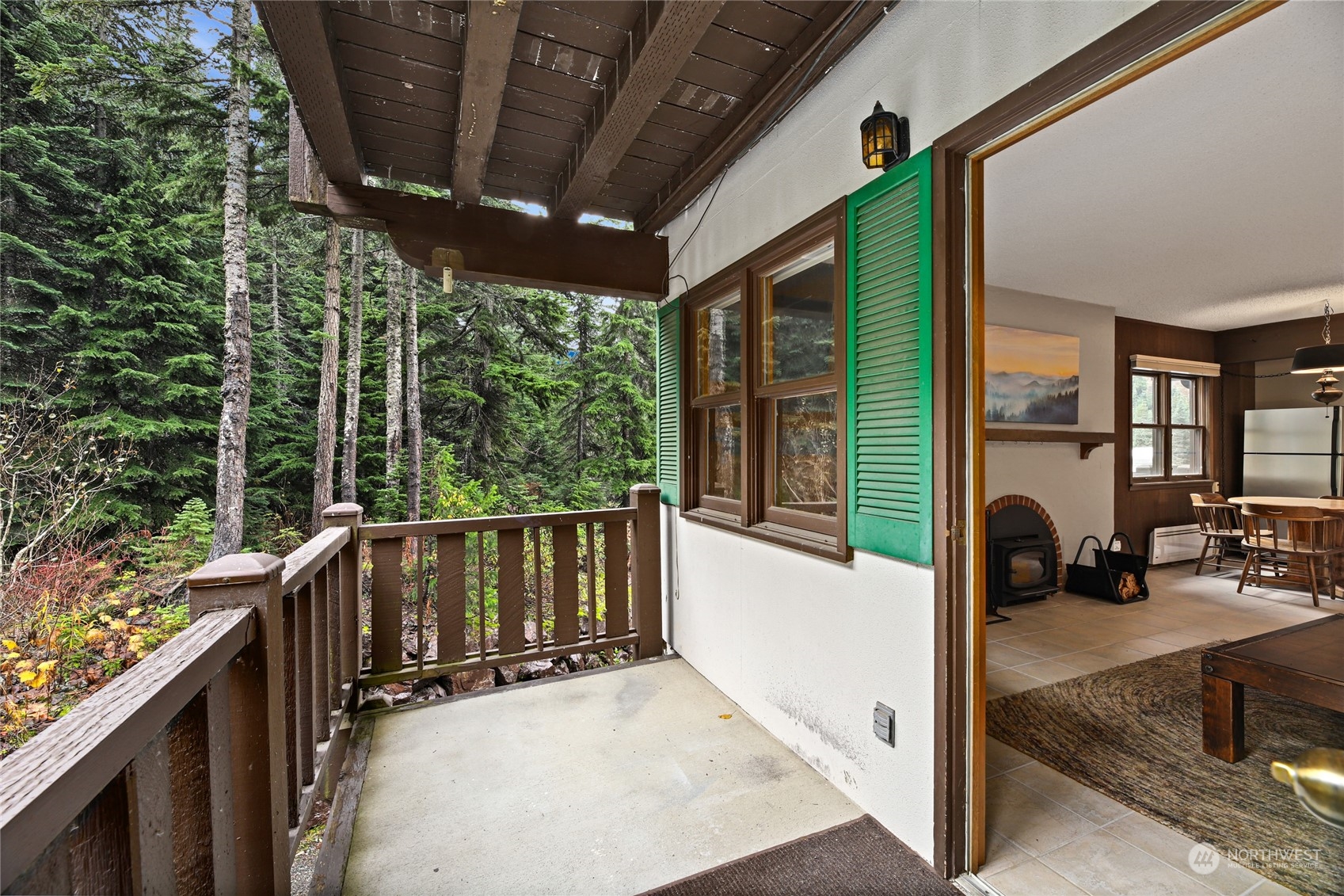 17700 Alpental Access Road, Unit 1006 Snoqualmie Pass, WA 98068 - Photo 13 of 26 a view of a porch with furniture and yard
