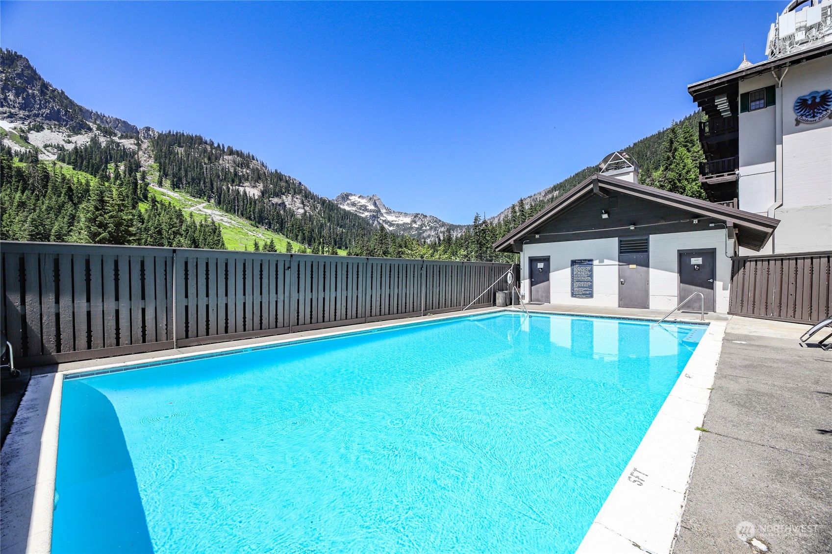 17700 Alpental Access Road, Unit 1006 Snoqualmie Pass, WA 98068 - Photo 20 of 26 a view of a house with a swimming pool
