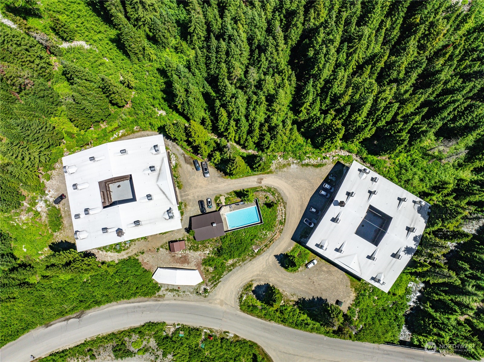 17700 Alpental Access Road, Unit 1006 Snoqualmie Pass, WA 98068 - Photo 23 of 26 an aerial view of a house with a yard