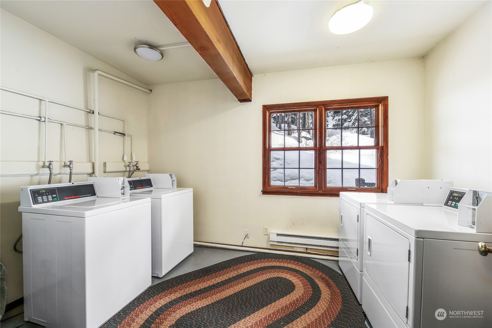 17700 Alpental Access Road, Unit 1006 Snoqualmie Pass, WA 98068 - Photo 25 of 26 a storage room with a washer and dryer