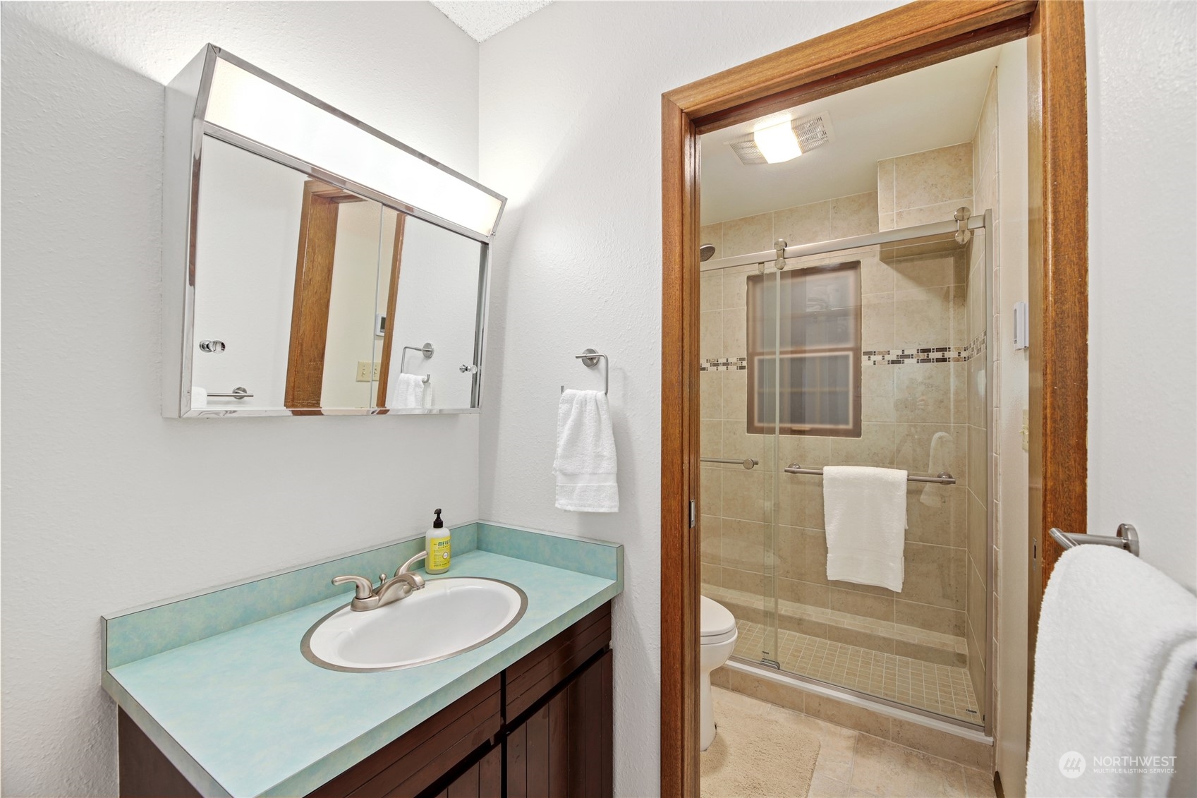 17700 Alpental Access Road, Unit 1006 Snoqualmie Pass, WA 98068 - Photo 9 of 26 a bathroom with a sink vanity granite and a mirror