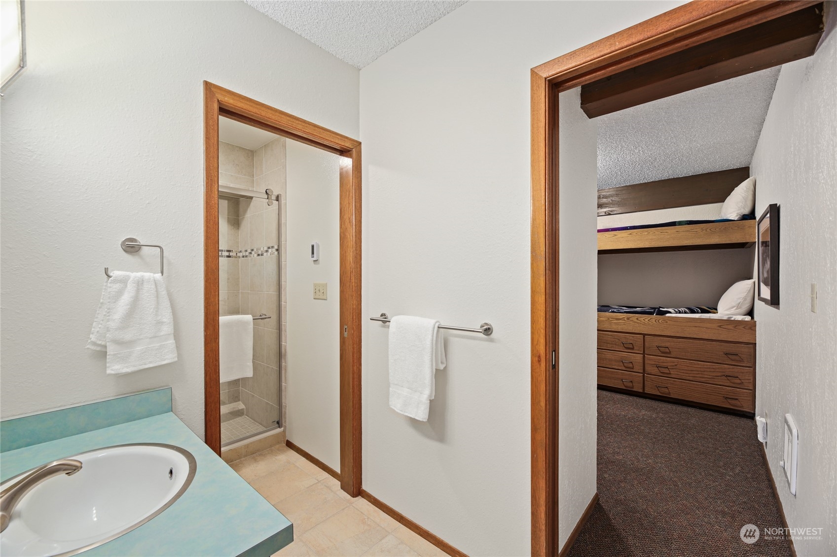 17700 Alpental Access Road, Unit 1006 Snoqualmie Pass, WA 98068 - Photo 10 of 26 a en suite bathroom with a sink a toilet and shower