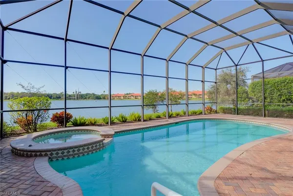 a view of a swimming pool with a yard