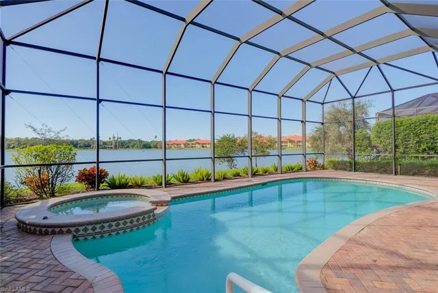 a view of a swimming pool with a yard