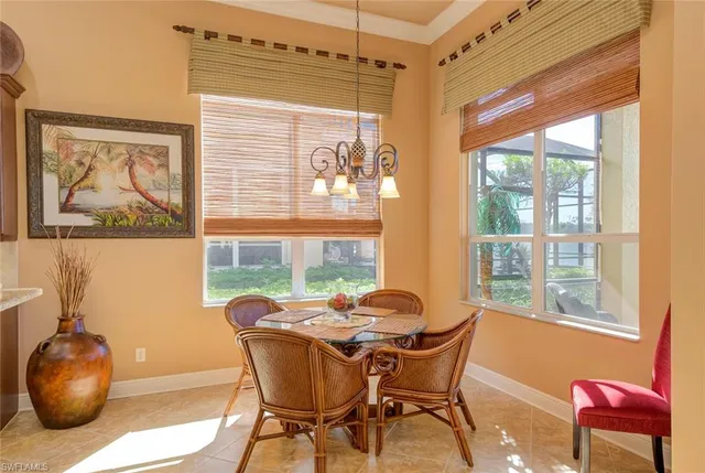 a dining room with furniture and window