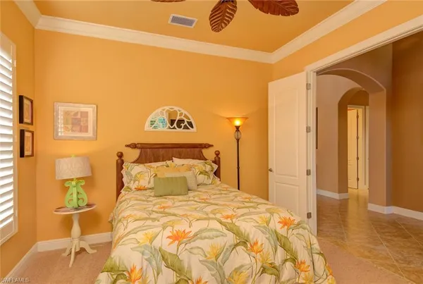 a bedroom with a bed and a cabinets